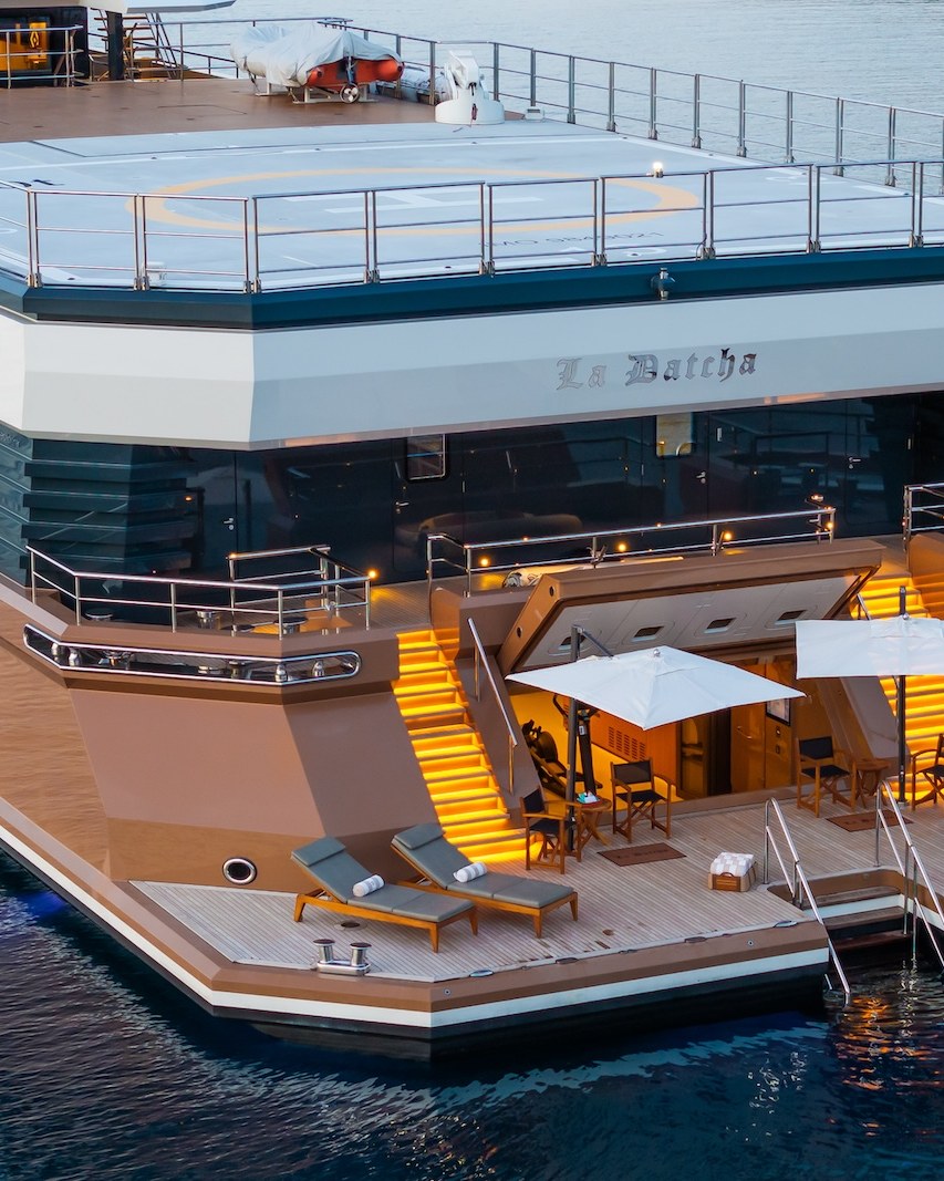 Twelve Guests, Six Staterooms. La Datcha's aft deck lit at dusk.